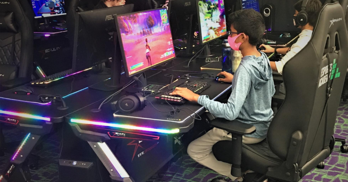 Young adult winning online video games tournament on pc, streaming